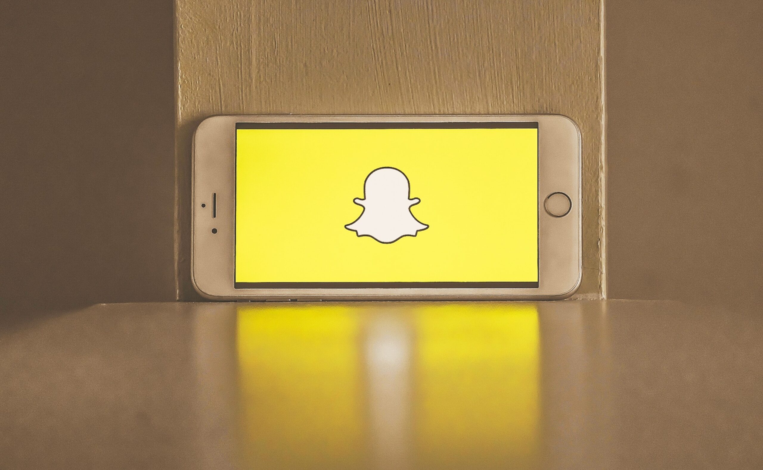 Snapchat logo in screen of a smartphone