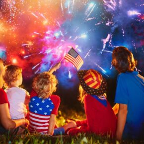 American family celebrating independence day with fireworks on 4th of July