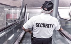 security personnel on the escalator going down