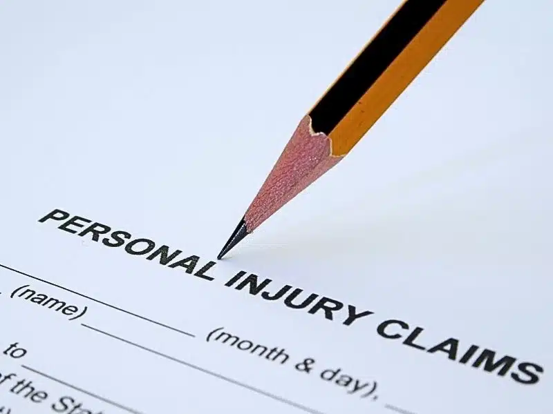 Personal injury claims form with a pencil. Types of personal injury cases