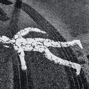 Pedestrian road figure covered in tire track marks. Is Halloween Dangerous