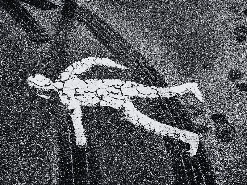 Pedestrian road figure covered in tire track marks. Is Halloween Dangerous