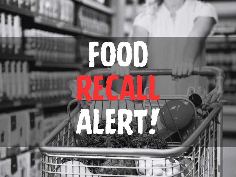 Defocused blur buying milk put on shelf in supermarket with food recall texts.