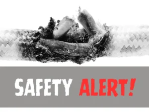 Burnt cable wire with safety alert text.