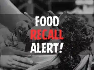 Food Recall Alert text overlay on image of hands holding a basket of fresh vegetables.