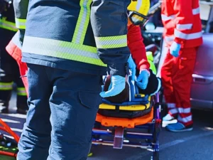 Firefighters and paramedics in a rescue operation after road traffic accident.