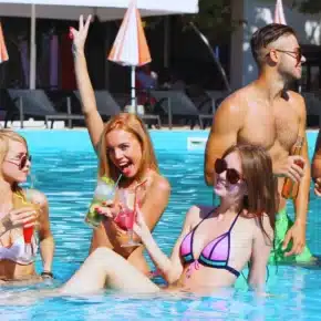 Young people having fun in the swimming pool. Pool Party Accidents