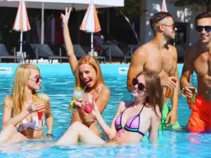Young people having fun in the swimming pool. Pool Party Accidents